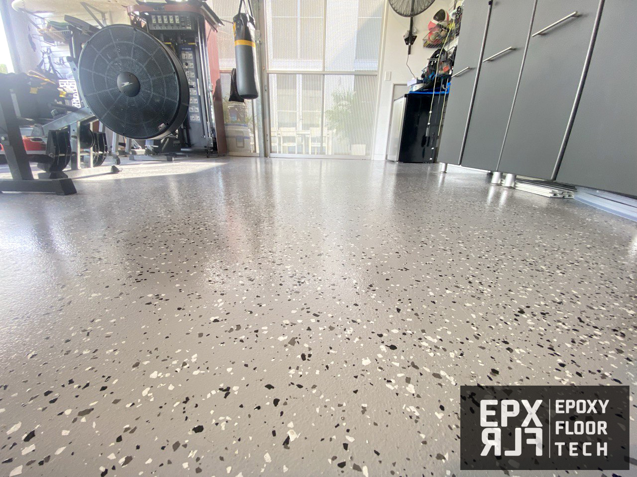 solid-white-colour-epoxy-garage-flooring home-gym-partial-flake-epoxy-floors-upper-north-shore